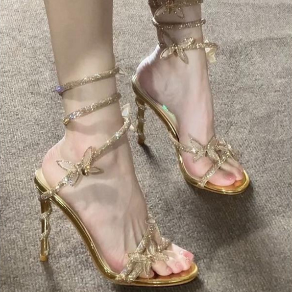Golden fashionable trend sandals with rhinestones