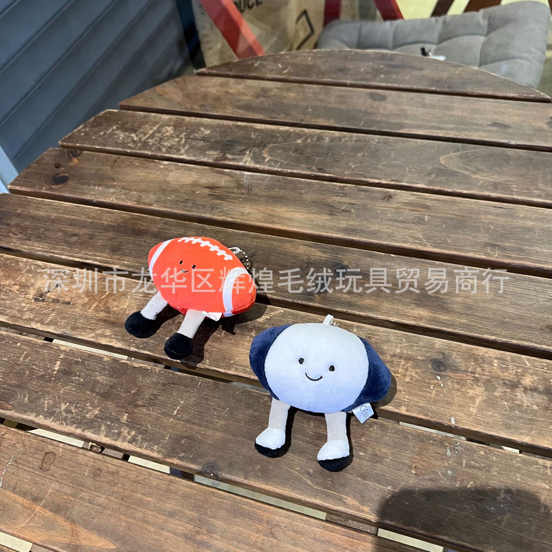 Spot fun sports table tennis tennis baseball football plush doll bag pendant video game city doll grabbing machine