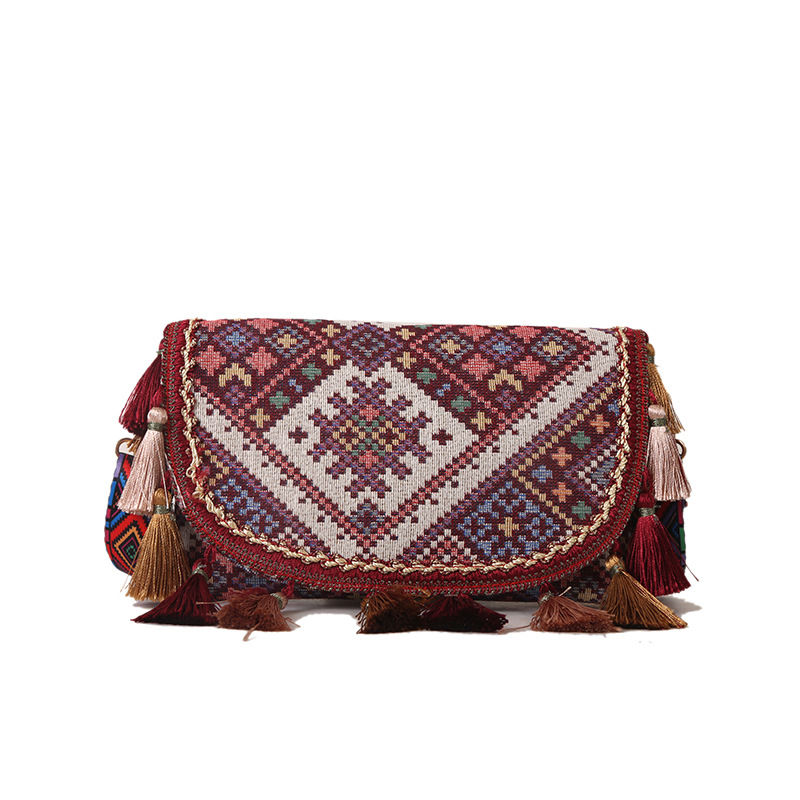 Nueva moda estilo étnico estudiante bolso de gran capacidad bolso de mano de las mujeres de estilo occidental borla bolso de hombro de las mujeres al por mayor