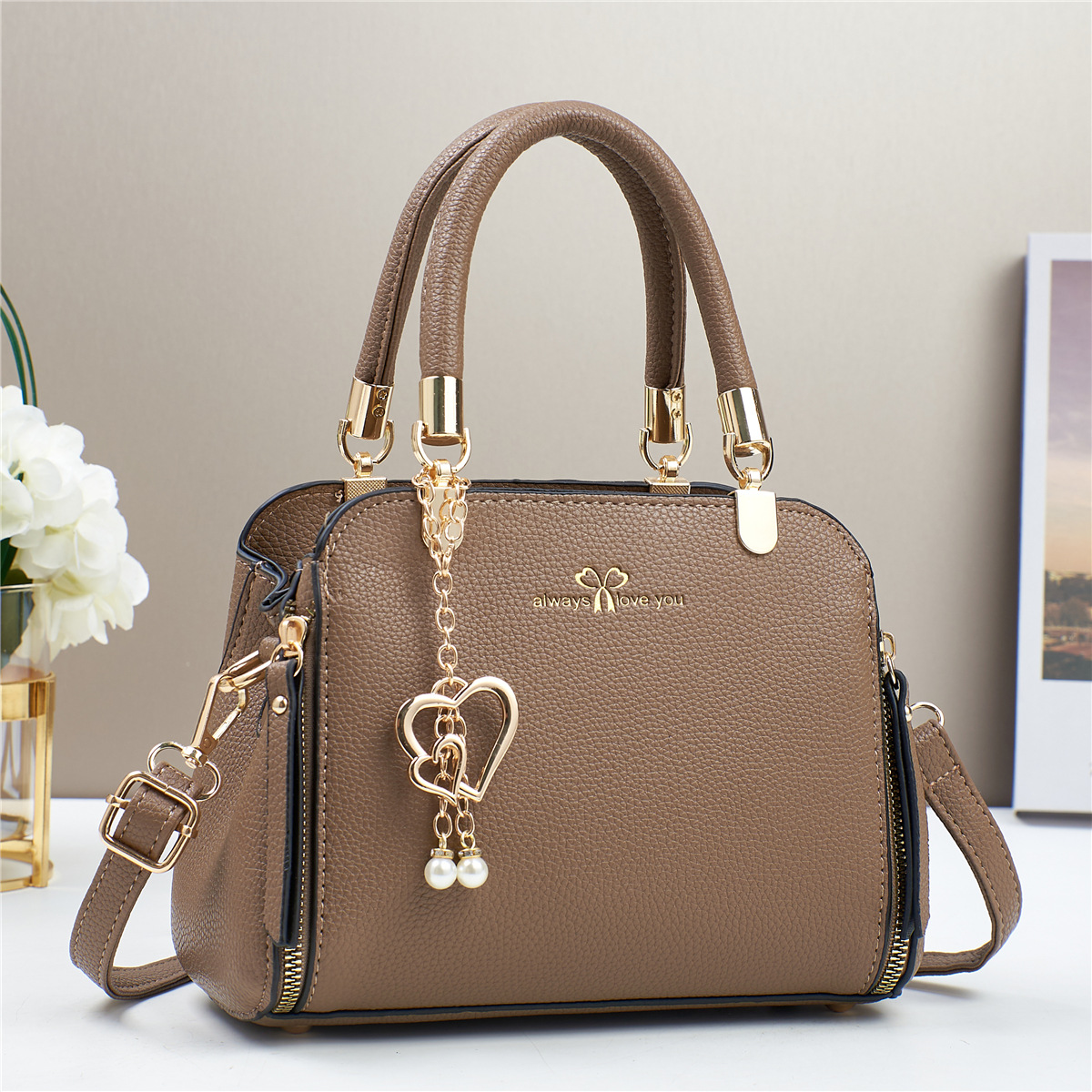 Bolso de mano de explosión bolso de mujer 2025 fabricante de comercio exterior nuevo bolso de hombro de verano atmósfera de moda universal
