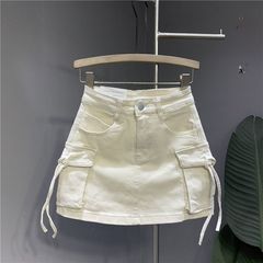 2025年夏のファッションの字の半身のスカートの個性の3次元のストラップのポケットの水洗いの弾力の工装のデニムのスカート