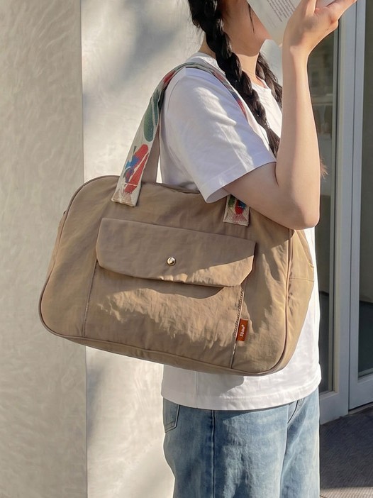Bolso de mano de gran capacidad para mujeres 2026 bolso de brazo ligero simple de hombro para viajar bolso de viaje