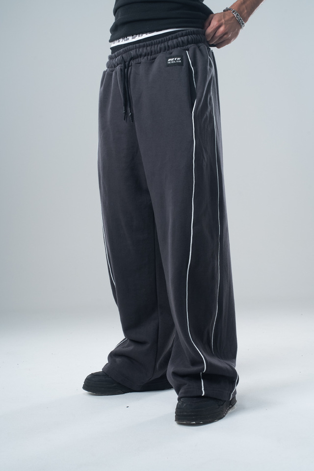 Pantalones deportivos casuales versátiles de pierna recta para otoño e invierno 2025, pantalones holgados retro de moda con costuras laterales de patchwork para hombre.