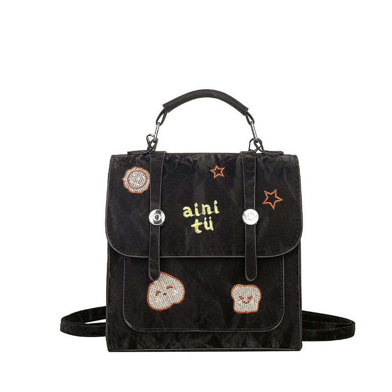 Bolsa universitaria viento rojo para mujeres 2025 nueva moda alta sensación de mochila de viaje universal mochila