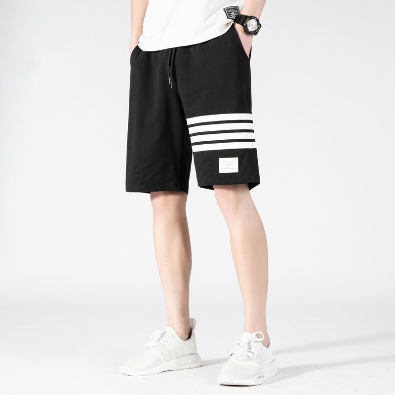 Nuevos pantalones cortos de estilo americano de verano de moda masculino delgado diseño de nicho relajado pantalones deportivos casuales de cinco puntos