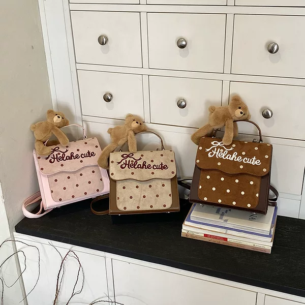 Korean-style preppy backpack for kindergarten children, featuring a trendy letter and polka dot design, and a cute little bear