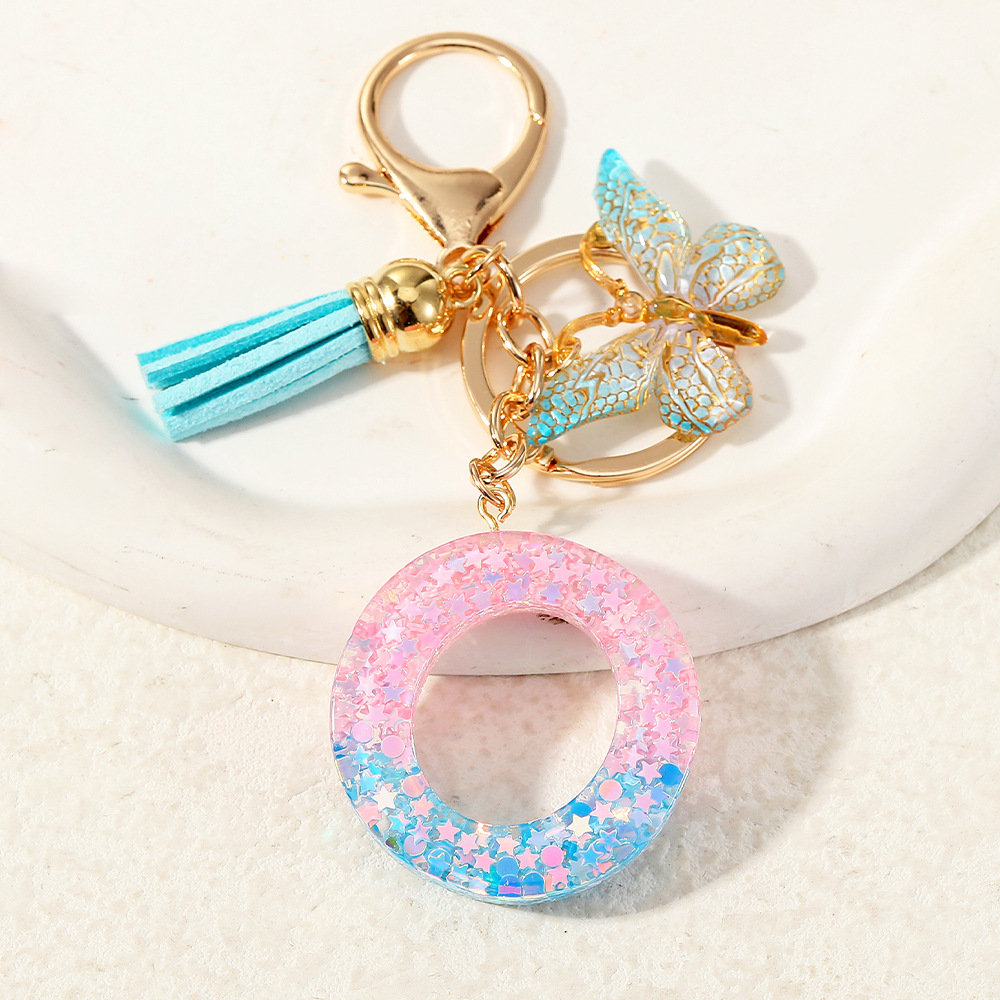 Europa y los Estados Unidos transfronterizos nuevos cristal sequinado goteo de goma letras inglesas joyería llavero y bolsos colgante apoyo al por mayor