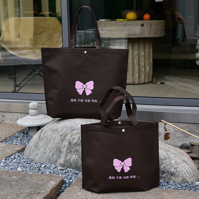 Bolso de mano no tejido de gran capacidad personalizado LOGO engrosado ropa de mujer protección ambiental bolsa de publicidad bolsa de compras de la tienda de ropa