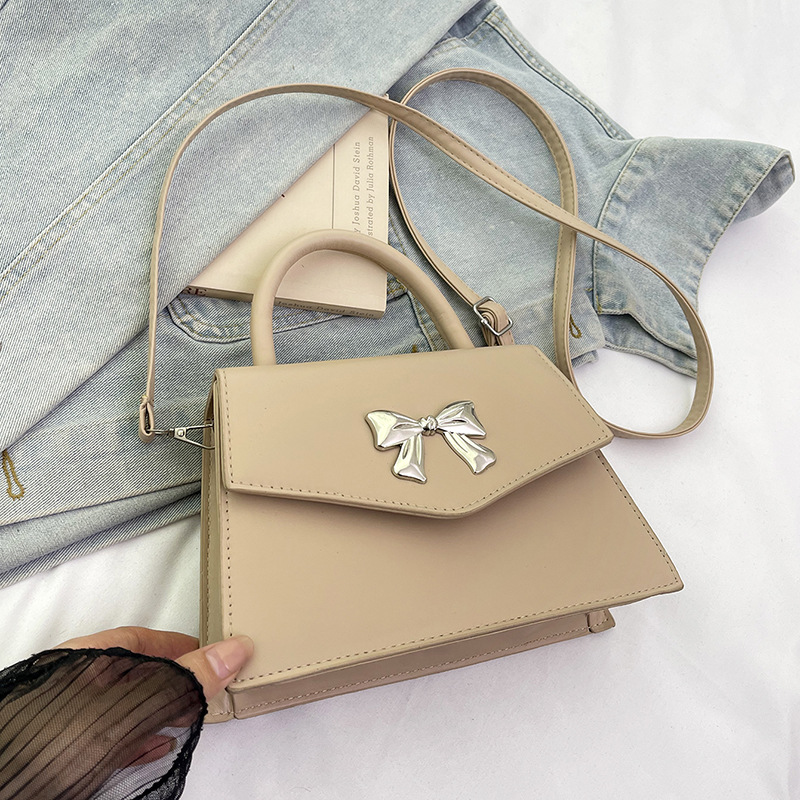 Arco de moda de verano 2025 hermoso nuevo estilo ocio de estilo extranjero suave portátil de hombro mochila pequeña bolsa de mujer