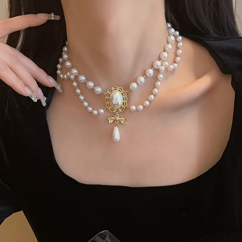 Elegante collana girocollo perle barocche con ciondolo oro_voghion.com