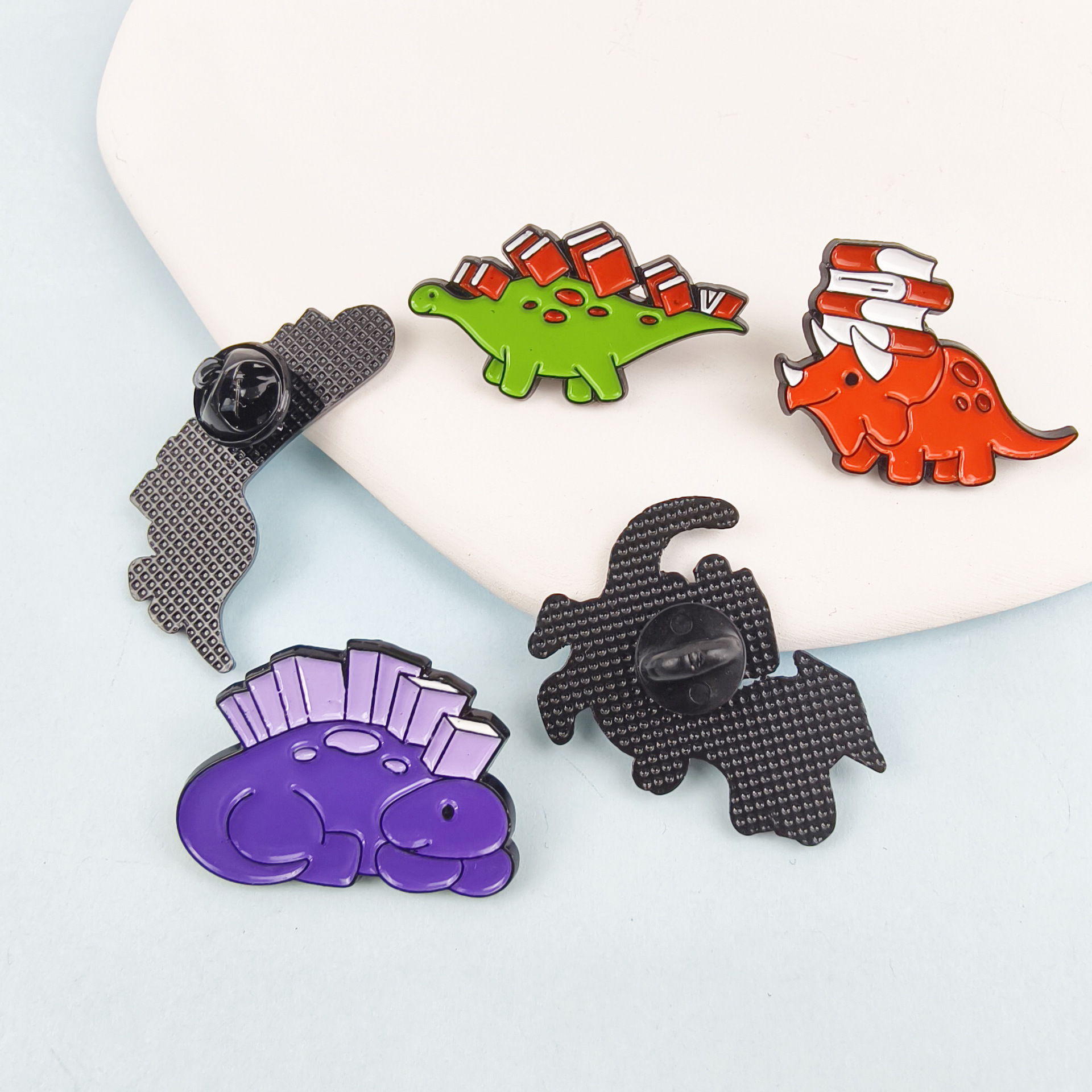 Insignia de broche de aceite de gota de aleación de dibujos animados, joyería europea y americana transfronteriza, lindo dinosaurio, aprendizaje, accesorios de libro, broche en stock