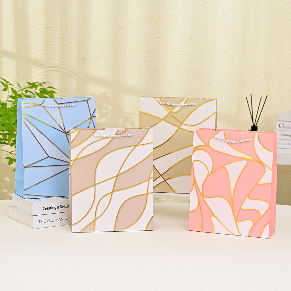 现代轻奢白卡手提袋简约高档烫金伴手礼品袋蛋黄酥牛轧糖包装纸袋