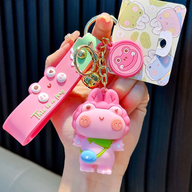 Keychain dinosaurio auténtico lindo bolso colgante de goma blanda llavero de automóvil muñeca pequeña máquina de regalos al por mayor image 30
