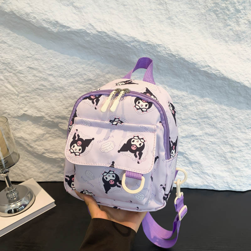 Mochila nueva al por mayor 2025, mochila de tela Oxford con diseño de dinosaurio de dibujos animados, mochila pequeña de gran capacidad para actividades al aire libre y ocio.