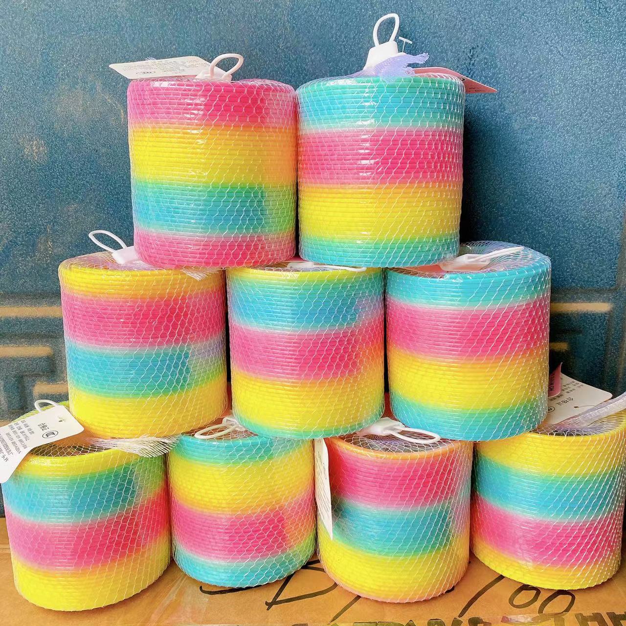 Gran anillo de arco iris puesto Venta caliente al por mayor 8,7*9cm anillo de arco iris niños primavera mágica hula hoop juego de rompecabezas