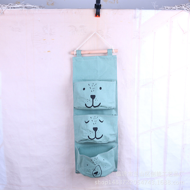 Expresión de dibujos animados de algodón y lino Bolsa colgante de almacenamiento de una pieza de tres bolsillos Bolsa colgante de almacenamiento de semicírculo Bolsa colgante decorativa Bolsa colgante