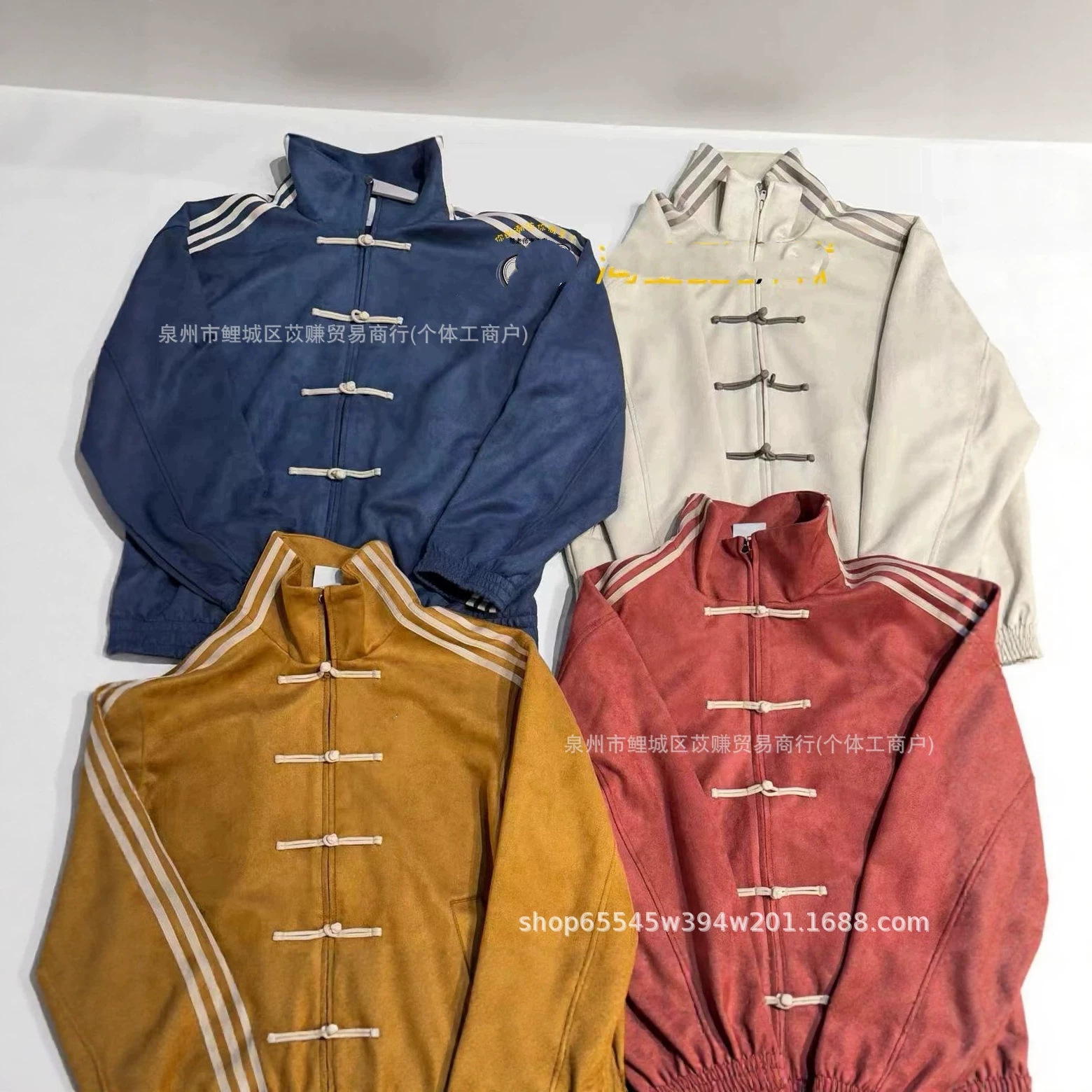 Trendy embroidered classic three-stripe Tang suit-style jacket with Chinese-style buttons, suede stand-up collar, unisex loose fit.