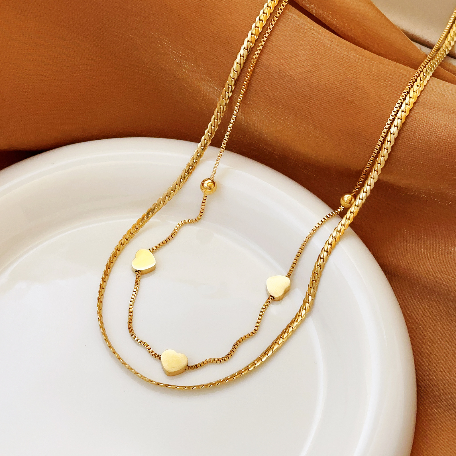 Europa y los Estados Unidos personalidad simplificada collar de hueso de serpiente joyas temperamento amor diseño colgante de acero de titanio conjunto de joyas para mujeres