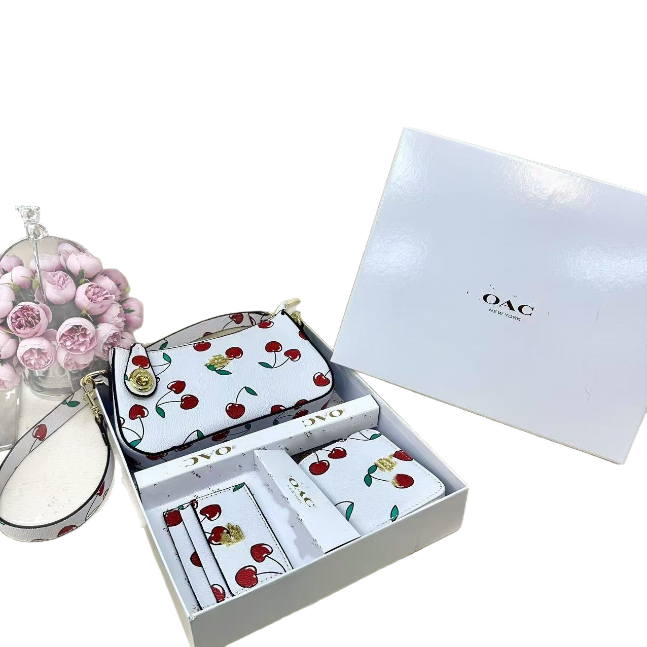 2025 nuevo Kome bolso brazo cartera de tres piezas conjunto de co caja bolsa de tarjetas de comercio exterior transfronterizo bolso de donación