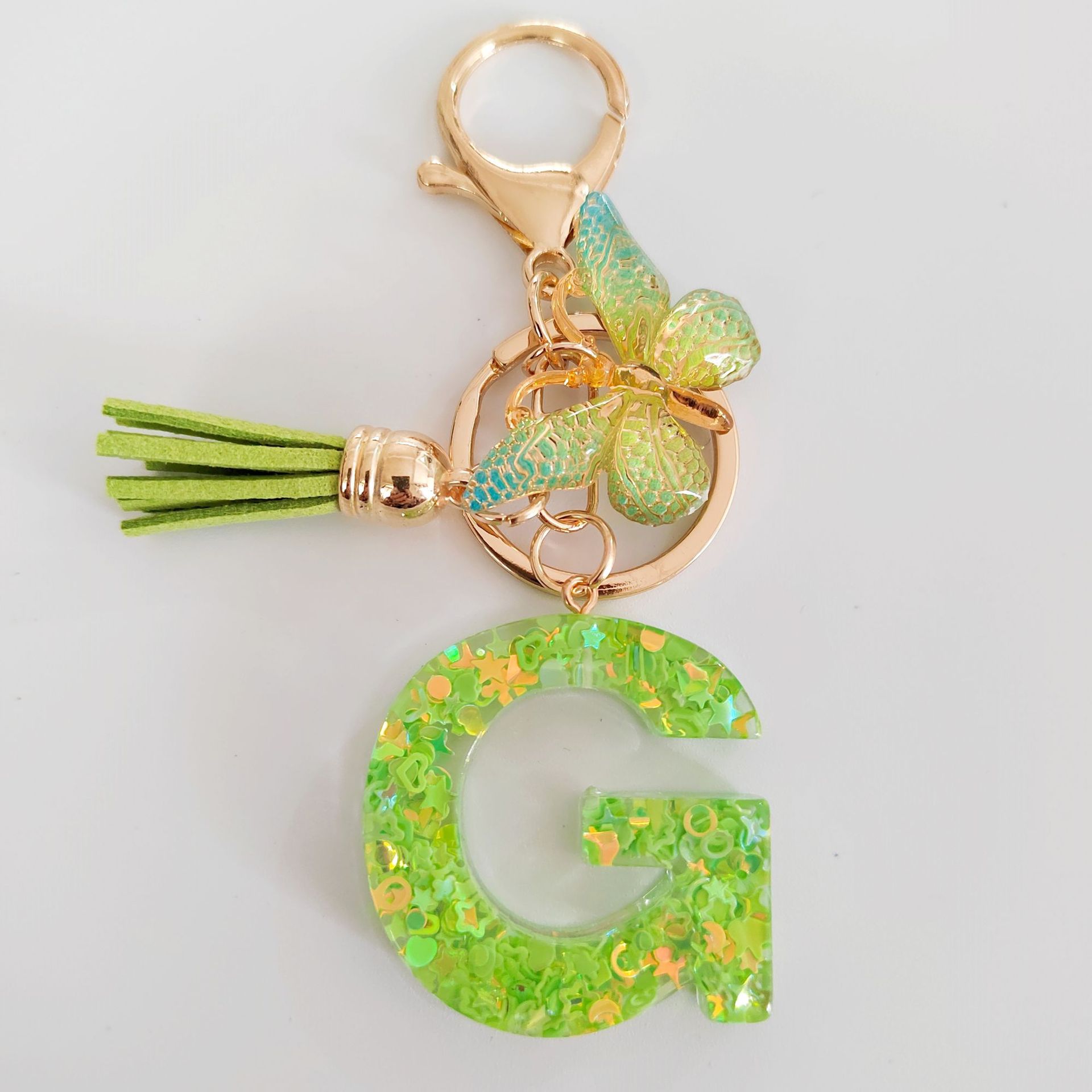 26 letras inglesas llavero colgante estrella verde brillo gota resina colgante llavero de personalidad europea y americana