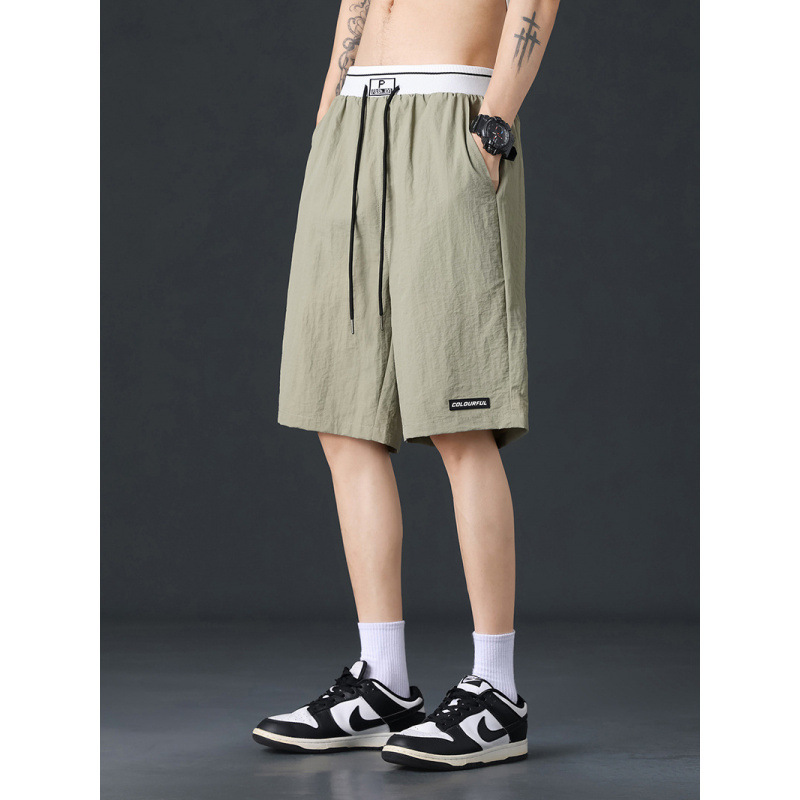 Pantalones cortos de hielo para hombres de verano negro delgado deportivo de hombre de verano rápido secado pantalones de baloncesto de playa de cinco puntos