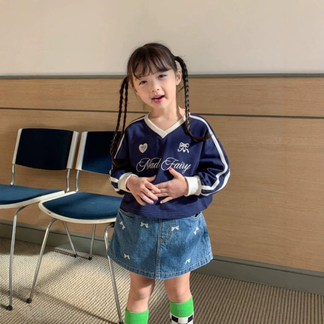 Ropa infantil coreana nueva falda de mitad primavera y verano niñas bordadas con arco lavado con agua vaquero estilo extranjero en forma de A falda de mitad