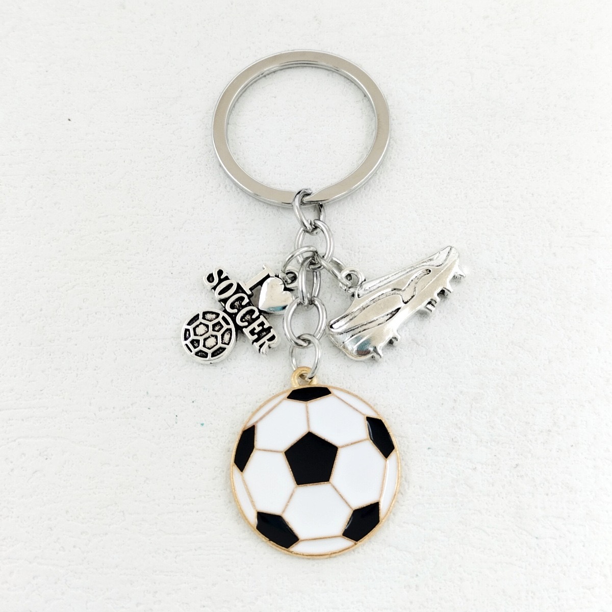 Serie de oro de aleación de venta transfronteriza caliente fútbol béisbol rugby sombrero hechicero puño llavero colgante mochila