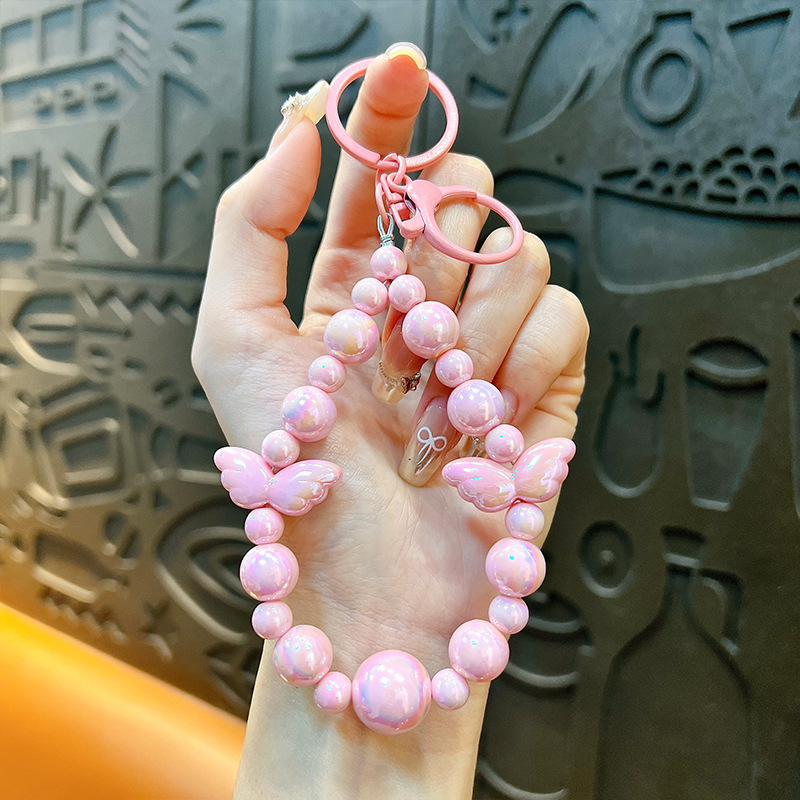Sala de transmisión directa con alas recuerdos llaveros lindos colgantes de teléfonos móviles accesorios de bolsos llaveros de automóviles al por mayor