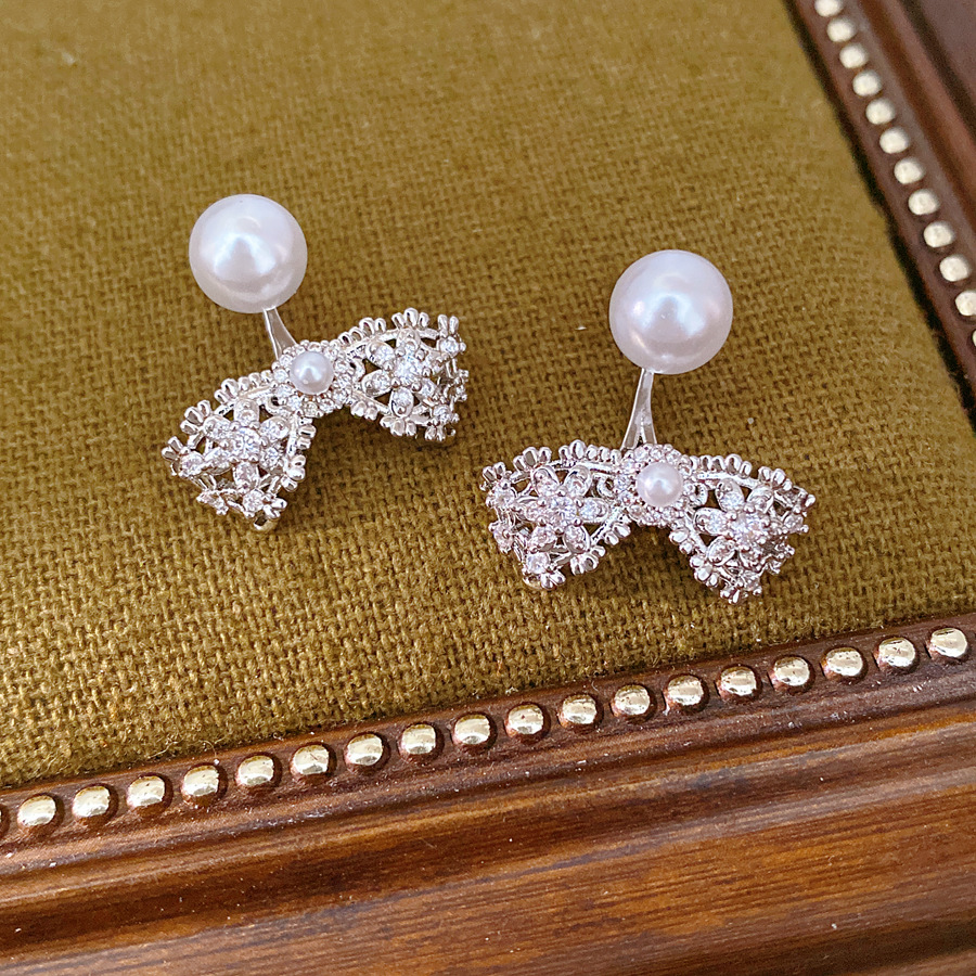 Agujas de plata Zircon arco perlas perlas orejetas coreanas exquisitas cotidianas de viaje versátil pendientes ligeros de lujo alta sensación de orejetas