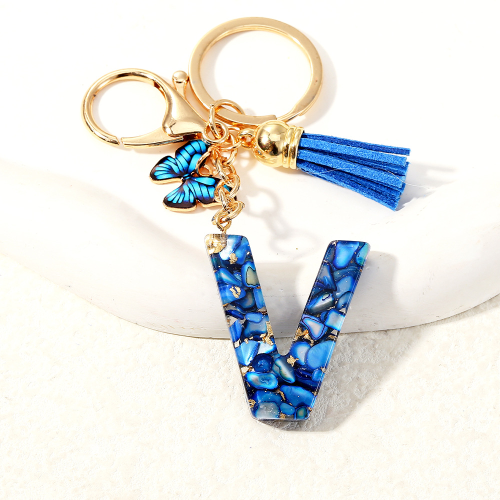 Nuevo transfronterizo mariposa 26 letras inglesas de cristal goteo llavero bolsos accesorios colgante de automóviles
