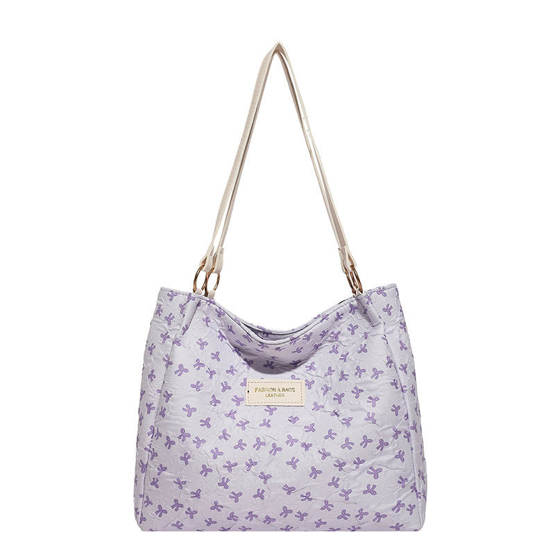 Bolso de tote 2025, primavera y verano, nuevo tipo de bolso de hombro, moda, bolso de mano, bolso de viaje de estilo extranjero para mujeres.