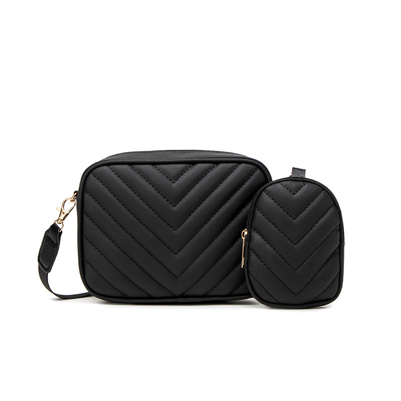 Bolsas de mujer al por mayor transfronterizas 2025 primavera y verano nueva bolsa de moda versátil bolsas de cámara de patrón en V cadena bordada bolsas de mochila