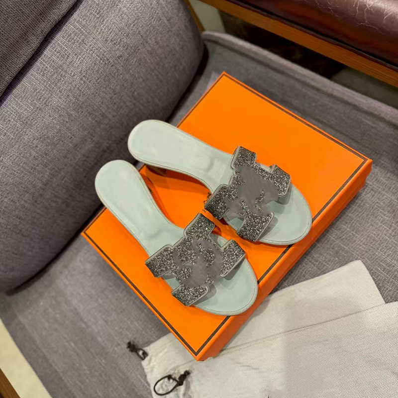 鼎羊皮の新型真皮平底ネット赤同タイプのスリッパ女性夏外着一字引きビーチカジュアル太さと涼しさ引き