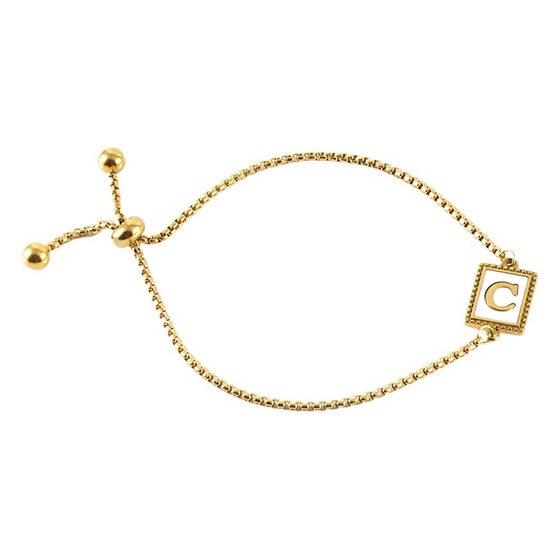 Nuevo europeo y americano transfronterizo de acero inoxidable 26 letras inglesas Shell pulsera personalidad todo partido titanio acero 18K cremallera