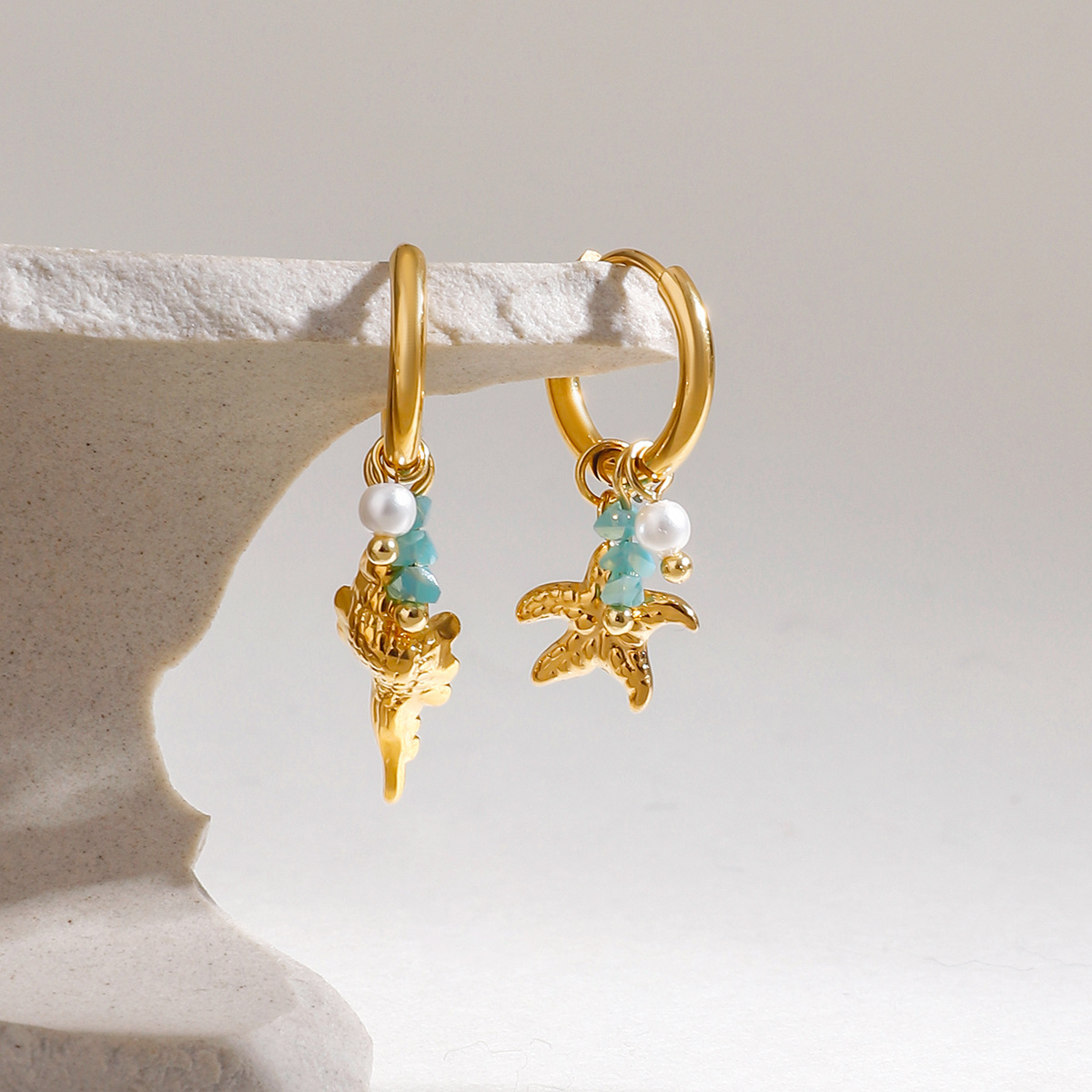 Wanxing Europa y los Estados Unidos de perlas de piedra triturada estrella de mar colgante de rosca de aretes de estilo marino estilo universal aretes de acero inoxidable transfronterizos
