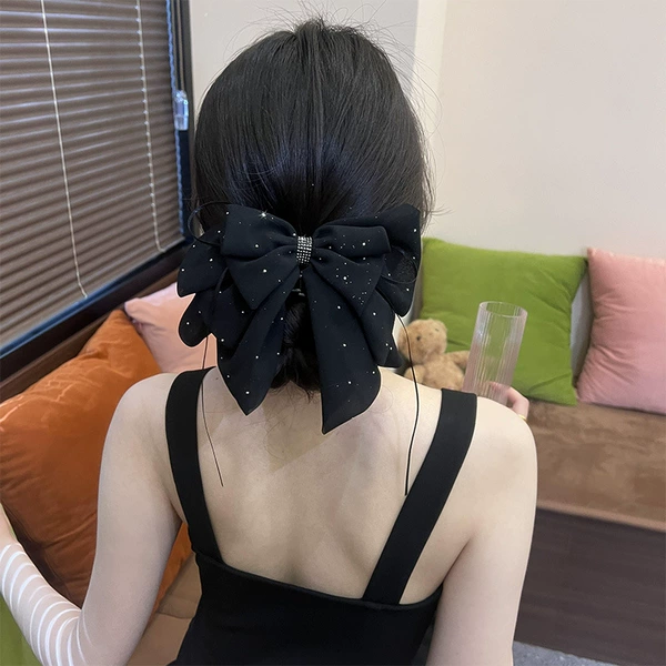 Black crab pin with bow with tassels