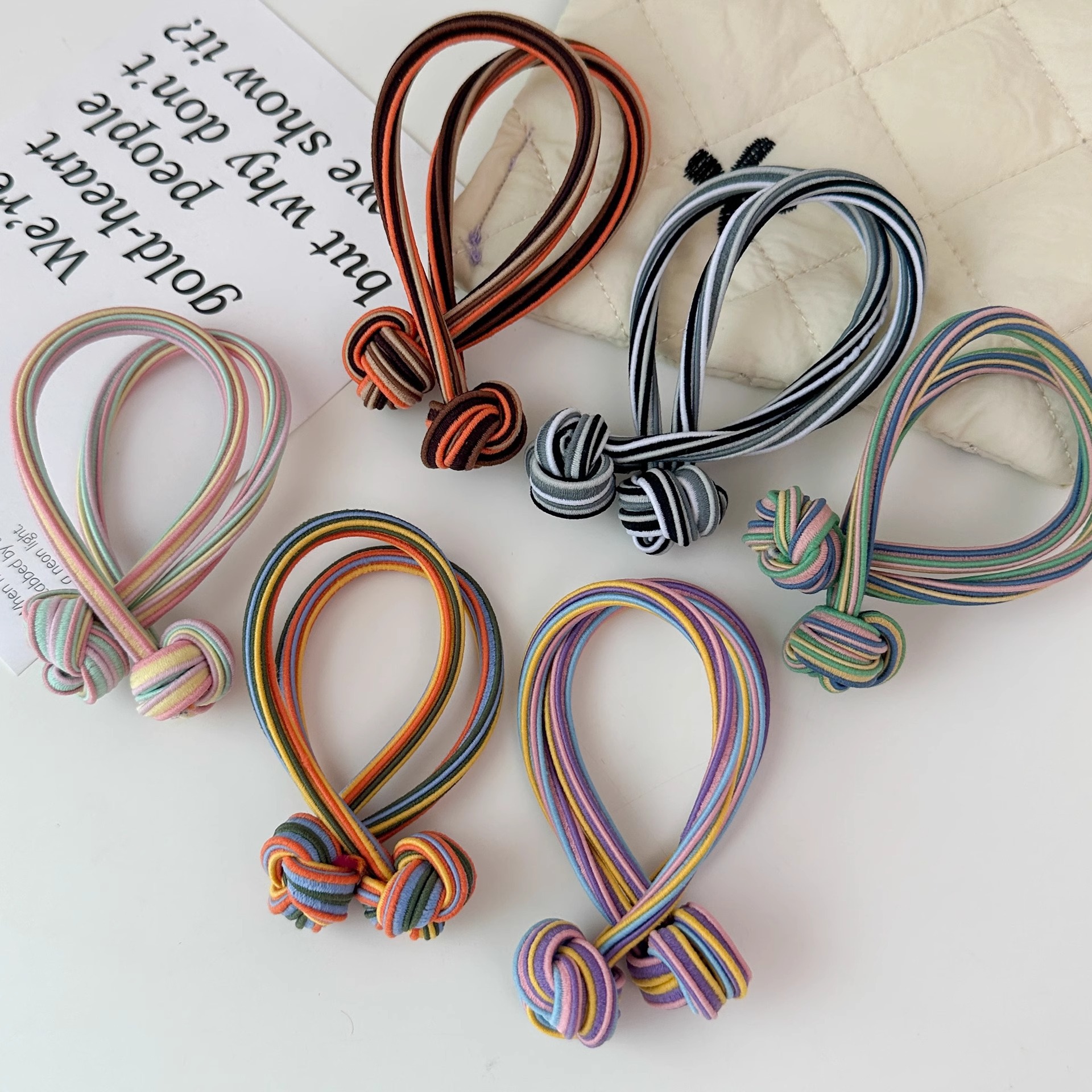 Anillo de cabello de nudo de cola de cabello de alta elasticidad no lesionar cabello de banda de goma roja durable cabello de cola de cabello de mujer al por mayor