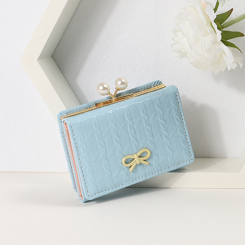 2024 nueva versión coreana de la billetera pequeña femenina corta de tres pliegues, billetera plegable para estudiantes, billetera de tarjeta de mariposa linda de dibujos animados, billetera
