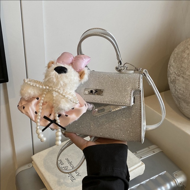 Bolso Kelly portátil de alta gama de moda transfronteriza para mujer 2025 nuevo estilo salvaje estilo occidental color sólido bolso de mensajero casual de un solo hombro