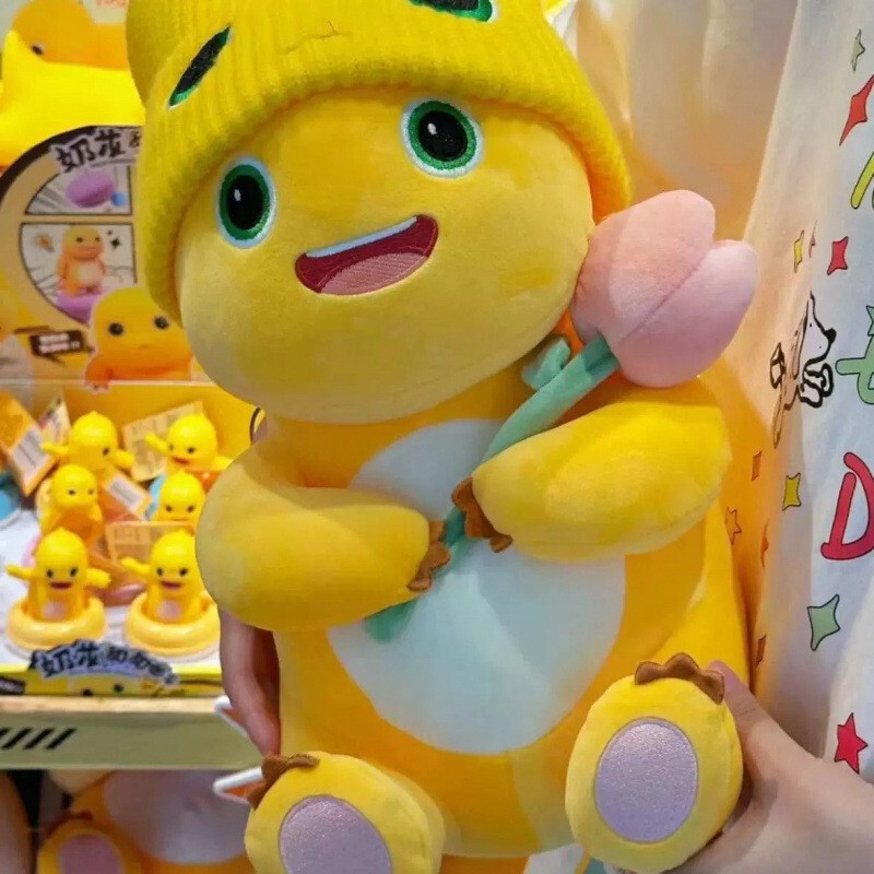 ドーナツ型のハグできる花を持ったミルクドラゴンのぬいぐるみ、可愛い恐竜のぬいぐるみ、ミルクドラゴンのぬいぐるみ卸売|undefined