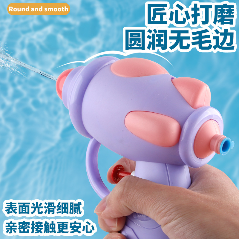 Nuevo juguete de pistola de agua para niños Juego de playa de verano botón al por mayor lindo color caramelo pequeña pistola de agua salpicaduras de agua Festival