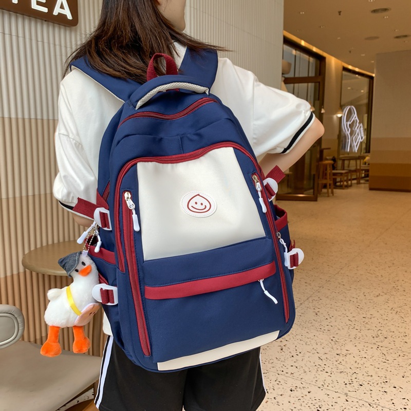 Mochila de lona coreana simple y versátil para mujeres 2023 nueva bolsa de gota de lluvia de gran capacidad mochila de ocio mochila de estudiantes