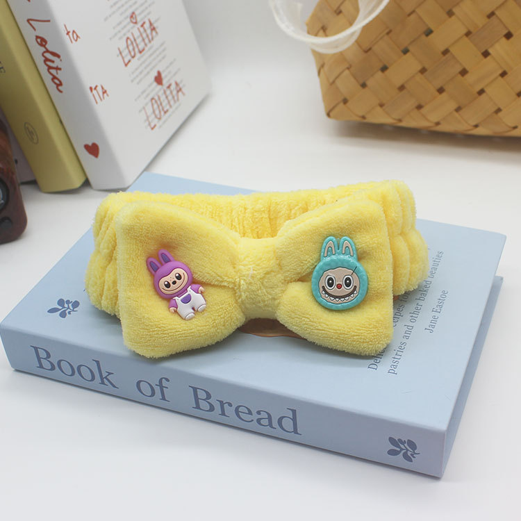 Nuevos dibujos animados tela de tela correa de pelo al por mayor extraña peluche lavado facial maquillaje de tela de tela de tela de banda de mariposa final de cabello de chicas