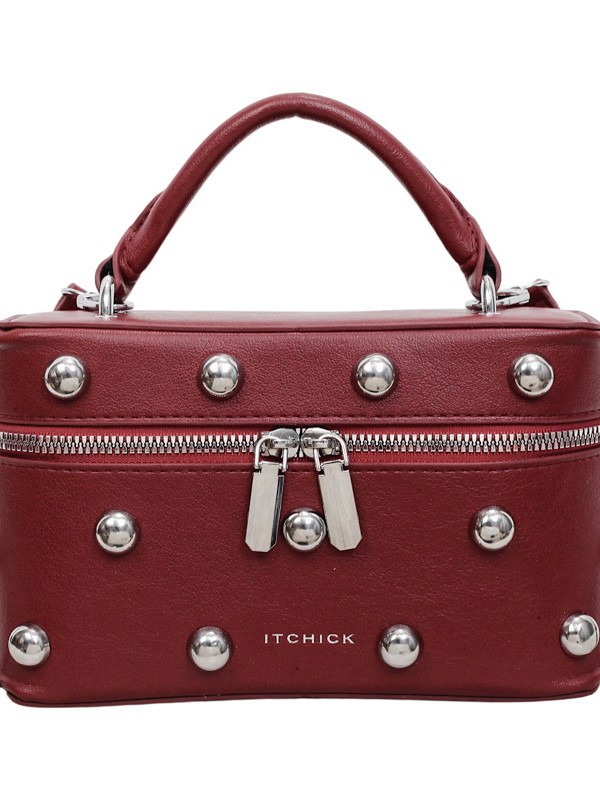 Bolsos portátiles de textura alta para mujeres 2026 nuevos nichos transfronterizos de diseño remaches de moda versátil bolso de mochila