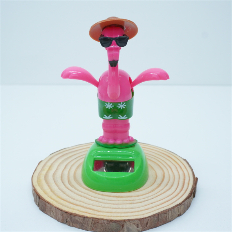 Venta caliente transfronteriza muebles oficina creativa flamenco balanceo animal sacudiendo la cabeza muñeca decoración de coche regalo de dibujos animados