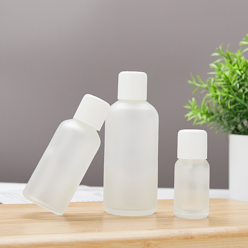 Botella de aceite esencial de vidrio esmerilado transparente a prueba de robo 10 - 100ml botella de emulsión esencia al por mayor