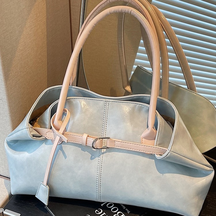 Bolsos de tendencia diaria coreana 2026 primavera nueva moda simple gran capacidad bolso de hombro bolso especial