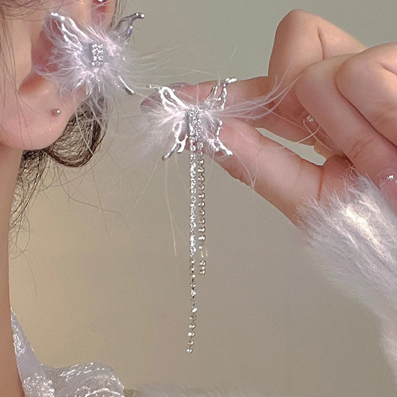 Diseño de nicho de alta gama borla larga sin orejas clip de oreja elegante estilo occidental de las mujeres cara-mirando pequeños nuevos pendientes de moda