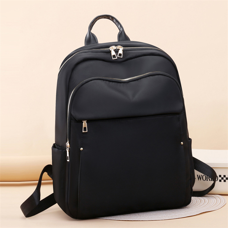 Comercio exterior al por mayor 2024 nuevas señoras de gran capacidad mochila para computadora de 15 pulgadas moda simple mochila de viaje ligera