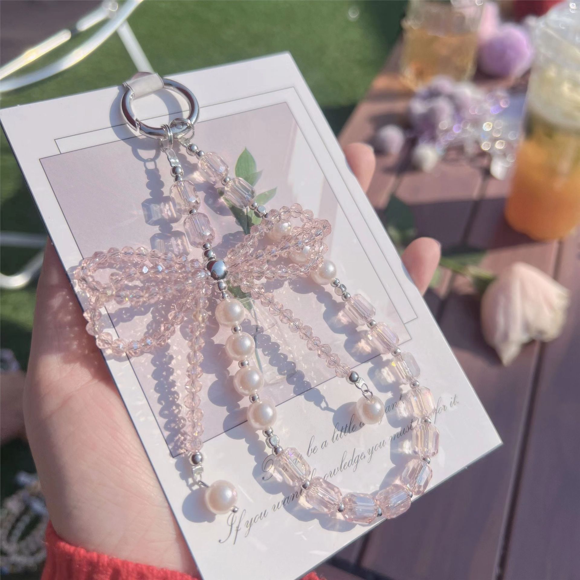 Lazo de perlas de lujo cadena de teléfono móvil cordón de teléfono móvil de alta gama cristal tridimensional corto exquisito cordón de muñeca ins